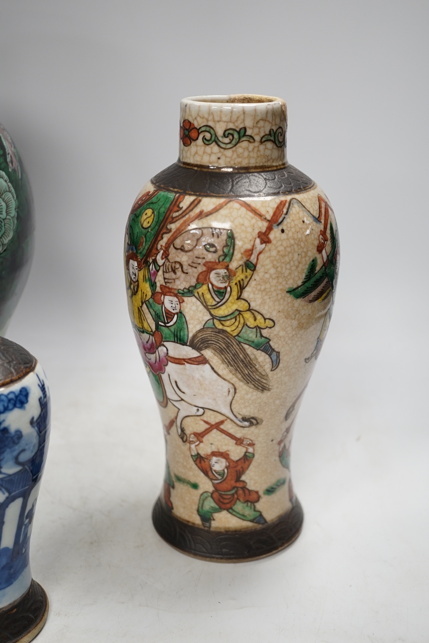 Three Chinese vases, 19th/early 20th century, including a cut down famille noire vase, crackleglaze and blue and white vases, tallest 34cm. Condition - fair to poor